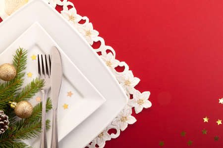 Christmas place setting with ribbon and christmas decorationsの写真素材