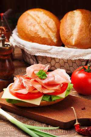 Prosciutto ham sandwich with vegetables.の写真素材