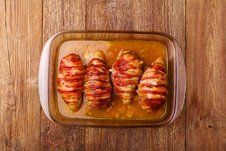 Delicious chicken rolls with dried tomatoes and mozzarella.の写真素材