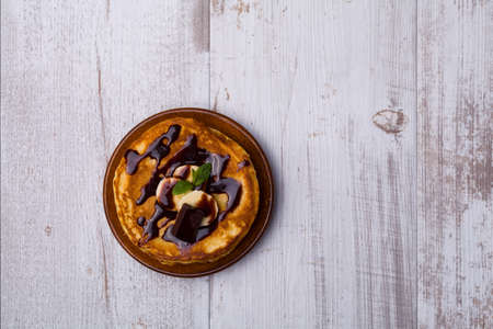 Delicious pancakes with bananas and chocolate.の写真素材