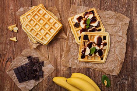 Delicious waffles with banana and chocolateの写真素材