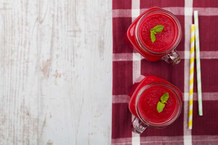 Vegetable and fruit cocktail, served in a jar, with fresh beets, apples, carrots and apples.の写真素材