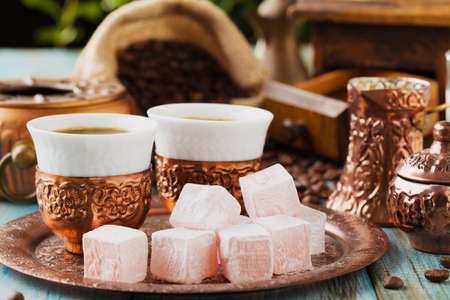 Traditionally brewed Turkish coffee. Specified in the original containers with Turkish delight.の写真素材