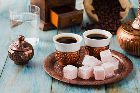 Traditionally brewed Turkish coffee. Specified in the original containers with Turkish delight.の写真素材