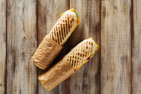 Traditional Italian sandwich with ham and cheese served warm.の写真素材