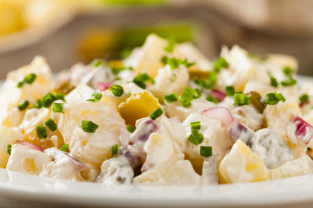 Traditional German potato salad with cucumber, onion and mayonnaise.の写真素材