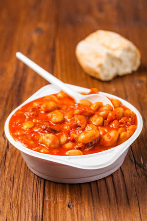 Baked beans in tomato sauce served in plastic cups. Front view.の写真素材