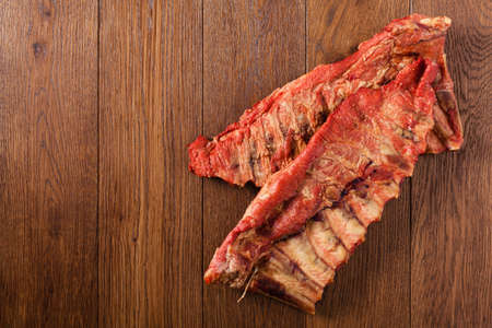 Smoked ribs on wooden table. Top view.の写真素材