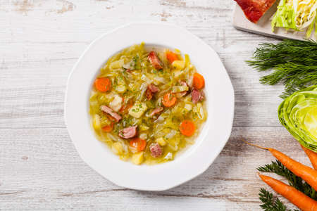 Homemade cabbage soup, cooked on smoked ribs. Top view.の写真素材