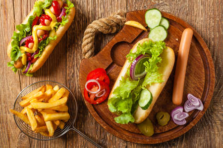 Delicious homemade hot dogs. Served with chips. Top view.の写真素材