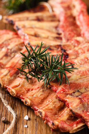 Smoked ribs on wooden table. Front view.の写真素材