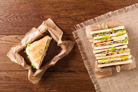 Delicious toast sandwich with ham, cheese, egg and vegetables. Top view.の写真素材