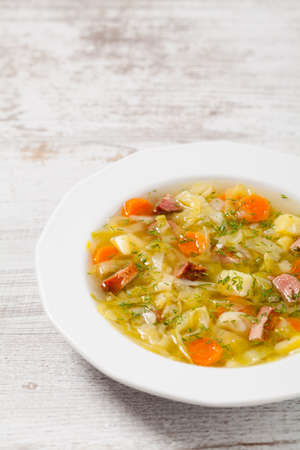 Homemade cabbage soup, cooked on smoked ribs. Front view.の写真素材