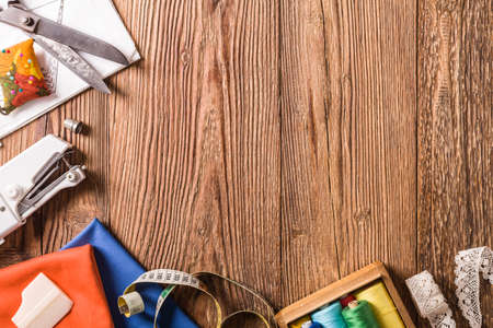 Tailor accessories. Concept. Natural wooden background. View from above.の写真素材