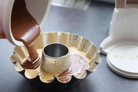 Baking cake last stage of pouring the finished cake into the mold.