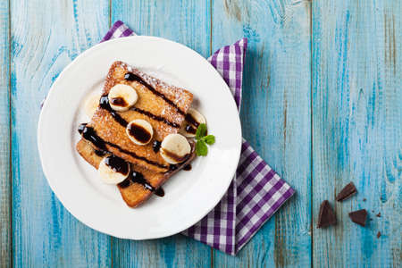 Traditional, delicious, sweet French toast with fruit and butter. Top view.の写真素材