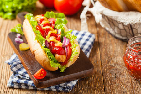 Delicious homemade hot dogs. Served with chips. Front view.の写真素材