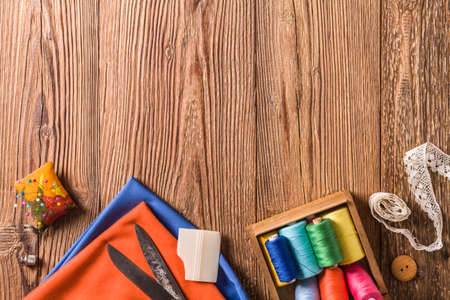 Tailor accessories. Concept. Natural wooden background. View from above.の写真素材