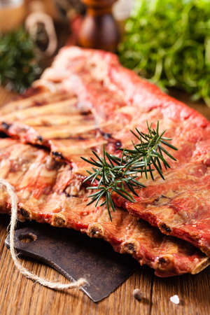 Smoked ribs on wooden table. Front view.の写真素材