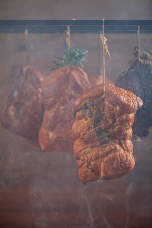 Smoked pork in a homemade smokehouse.の写真素材