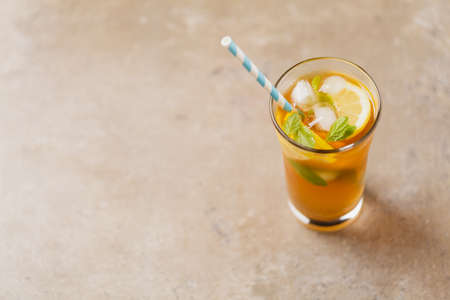 Iced tea with lemon and ice cubes. の写真素材