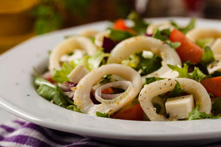 Salad with squid rings. Front view.の写真素材