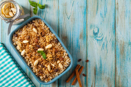 Traditional, mexican baked sweet rice, with almonds, raisins and walnuts. Top view.の写真素材