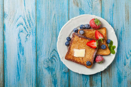 Traditional, delicious, sweet French toast with fruit and butter. Top view.の写真素材