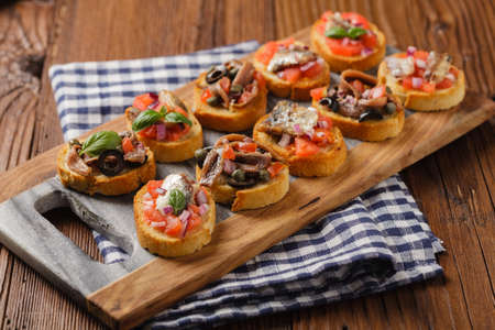 Mix Bruschetta with sardines and anchovies. Front view.の写真素材