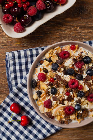 Breakfast, muesli with milk and fresh fruit. Top view. Flat lay.