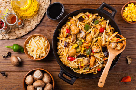 Indonesian pasta with chicken, pieces of bamboo and mushrooms. Top view.の写真素材