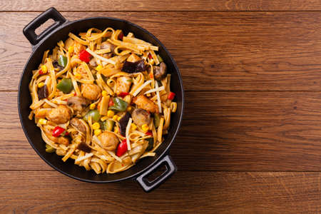 Indonesian pasta with chicken, pieces of bamboo and mushrooms. Top view.の写真素材