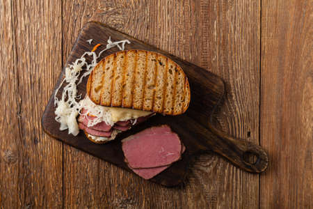Ruben sandwich. New York sandwich with pastrami, sauce thousand islands and sauerkraut. Top view. Fast food.の写真素材