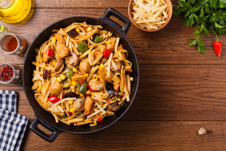 Indonesian pasta with chicken, pieces of bamboo and mushrooms. Top view. の写真素材