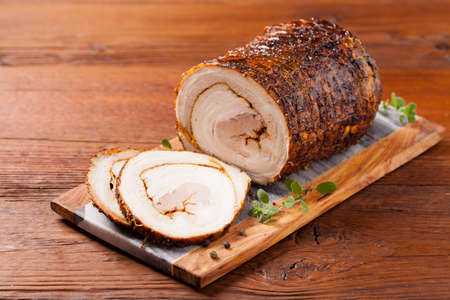 Rolled, roasted pork belly. Front view.の写真素材