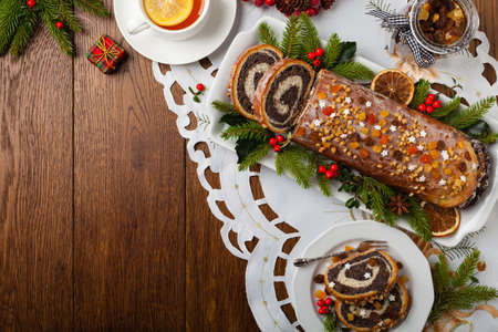 Poppy seed roulade in Christmas decoration. Served with coffee or tea. Top view.の写真素材