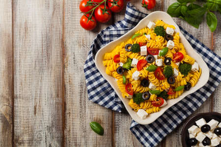 Salad with pasta and feta cheese. Top view. Flat lay.の写真素材