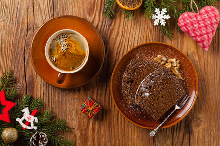 Homemade gingerbread cake. Christmas decoration. Top view. Natural wooden background.の写真素材