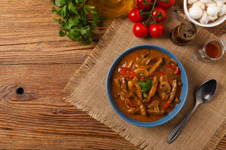 Boeuf, Stroganow, Strogonow. Classic, Russian beef stew. Served in a blue bowl. Top view. Natural background.の写真素材