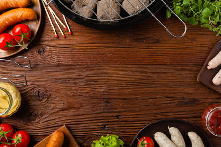 Raw, ready-to-make sausages. Grill accessories. Concept. Place for description. Top view.の写真素材