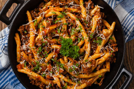 Maccheroni al ferretto with beef in ragu bolognese. Top view.の写真素材