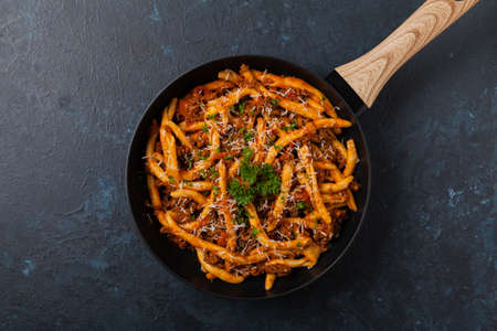 Maccheroni al ferretto with beef in ragu bolognese. Top view.の写真素材