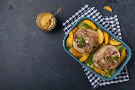 Boiled knuckle, served with cabbage and baked potatoes.の写真素材