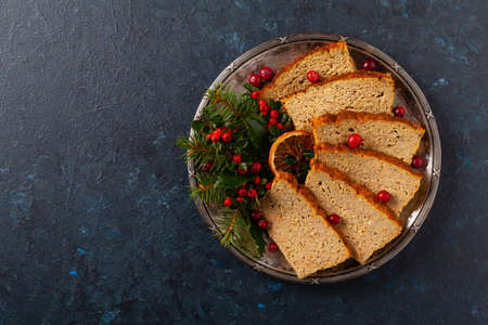 Delicious chicken and pork pate in Christmas decoration. Rustic style. Dark background, metal...