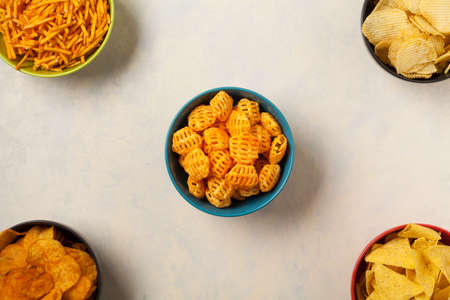 Bowls with snacks like chips, crisps, popcorn. Perfect for a party. Top view.の写真素材