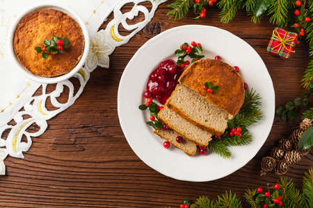 Small, baked patties in Christmas retro styling. Top view. Natural wooden background.の写真素材