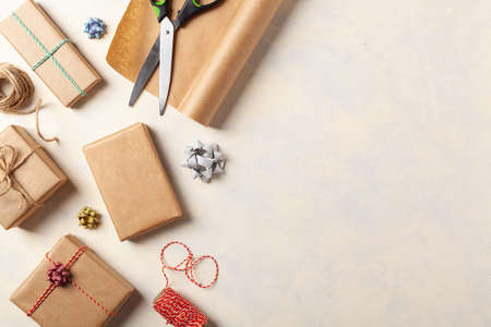Gift Wrapping. A bright background with packaging accessories and gifts. Creative composition. Place...