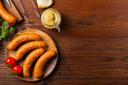 Raw, ready-to-make sausages. Grill accessories. Concept. Place for description. Top view.