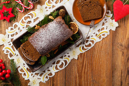 Homemade gingerbread cake. Christmas decoration. Top view. Natural wooden background.の写真素材