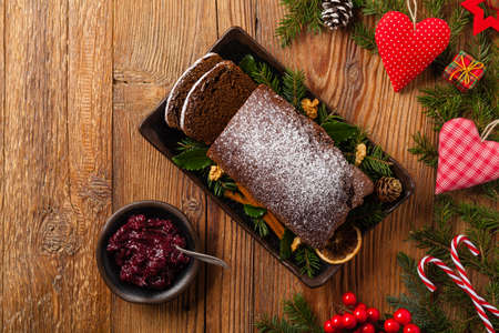 Homemade gingerbread cake. Christmas decoration. Top view. Natural wooden background.の写真素材